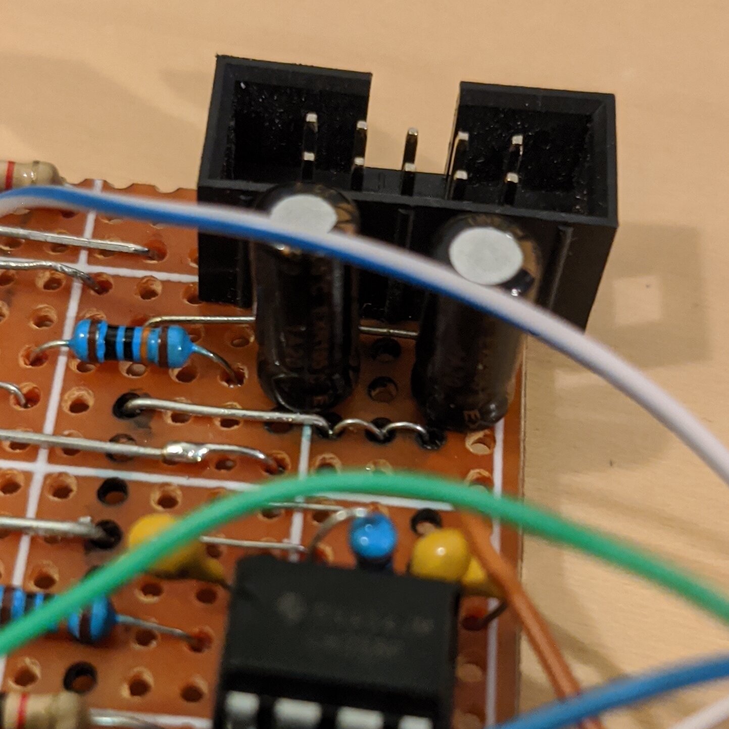 Closeup of power input connector and jumpers on the board