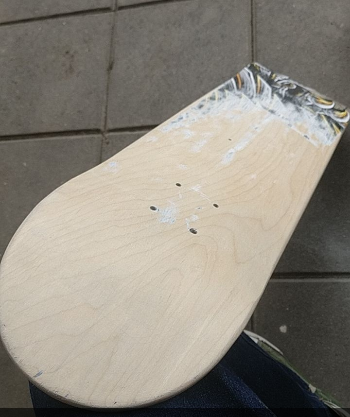 sanding the skateboard